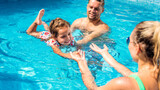 Fototapeta  - Happy family in the pool