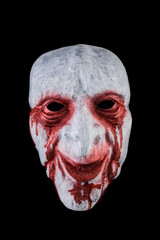 Wall Mural - Creepy bloody head isolated on black background with clipping path