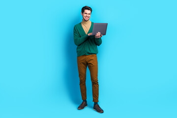 Aufkleber - Full body photo of young businessman working remote his new apple laptop computer modern gadget device isolated on blue color background