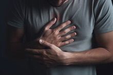 A Man With Heart Pain In His Chest, Keeps His Hands On His Chest.