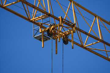 Canvas Print - Crane. Close up view of a crane rolling system for lifting heavy objects. Construction industry.