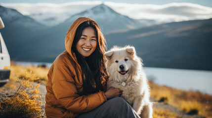 Wall Mural -  woman travelling with Siberian Husky Dog. she's beautiful smile. view of mountain and lake background in the daylight morning.