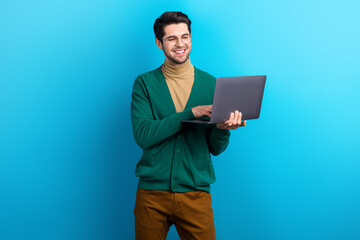 Aufkleber - Photo of cheerful charming guy dressed green cardigan eyewear working modern gadget isolated blue color background