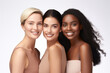 © Ai Studio - Three delighted multiracial women smiling, standing together on white