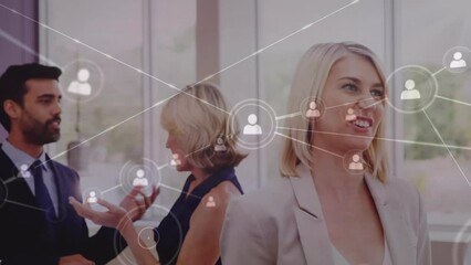 Poster - Animation of icons connected with lines over diverse coworkers sharing ideas in office