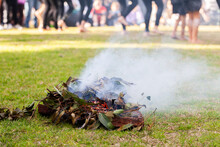 Smoking Ceremony At Event During Aboriginal Dance Showing Burning Leaves