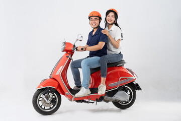 Wall Mural - image of asian couple riding scooter on white background