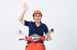 © 1112000 - a man wearing a helmet and driving a motorcycle