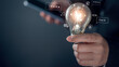 © The KonG - Artificial Intelligence, Ai tech generate coding, art, music. Hand hold light bulb  the best idea from Chat AI. Command prompt for generates something, Futuristic technology transformation.