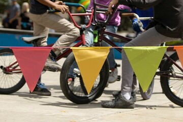 Array of colorful line of flags hung along the sidewalk