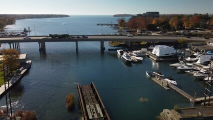 Canvas Print - Aerial timelapse video of traffic flowing on the Orillia Narrows overpass in Autumn, Canada