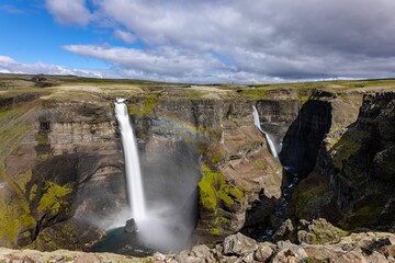 Sticker - Scenic landscape featuring the Haifoss waterfall cascading over a rocky hillside