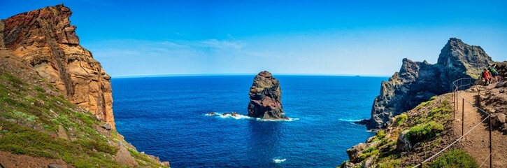 Poster - a couple of steps down to the ocean with blue skies and blue water