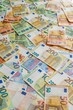 © Lucija Kanižaj/Wirestock Creators - euros currency money are scattered together and laying on the ground