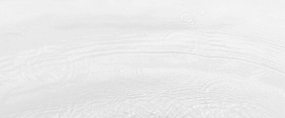 white wave abstract or rippled water texture background, white water with ripples on the surface, water waves with shining pattern texture background.