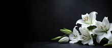 A Banner With A Dark Background And White Lily Flowers. Mourning Is Depicted Through The Imagery. Remembering And Mourning Are Emphasized. The Photo Has A Close-up, Side View With Selective Focus