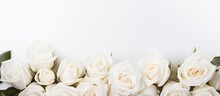 A Banner For A Website Header Design Featuring A Wedding Bouquet Of White Roses On A White Background With A Soft Focus. Copy Space Available.