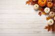 © tiena - Autumn simple background with a pumpkins and fall leaves. AI generated