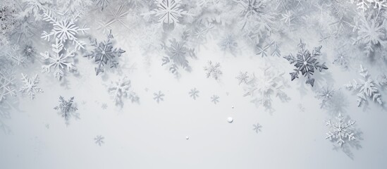 Poster - A Christmas picture made up of snowflakes on a pale gray background. Represents the winter season. Photographed from above with the frame laid out and room for text.