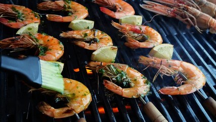 Wall Mural - Cooking shrimp, prawn, langoustines on grill, barbecue, hot cast iron grate. Close up. Outdoor