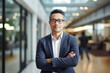 © Moritz - Leader in Innovation: High-Resolution Portrait of a Young Tech CEO Standing in a Bustling Office