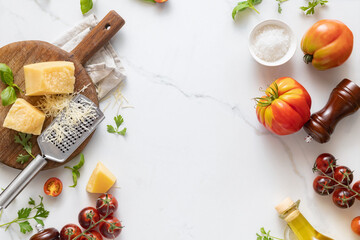 Aufkleber - Frame of food cooking ingredients background with fresh vegetables, herbs, spices olive oil and cheese on white stone table top view. Healthy vegetarian eating