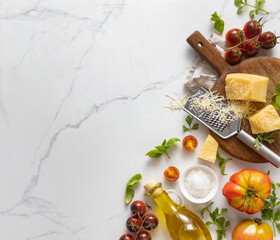 Aufkleber - Food cooking ingredients background with fresh vegetables, herbs, spices olive oil and cheese on white stone table top view. Healthy vegetarian eating