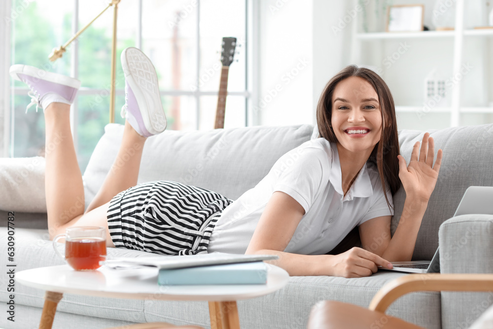 Young woman using laptop on her day off at home