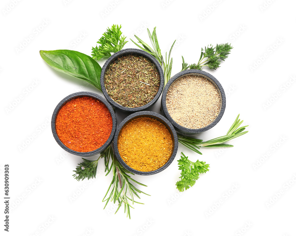 Composition with bowls of fresh spices and herbs isolated on white background
