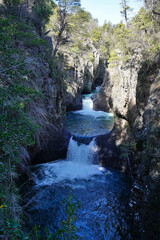 Wall Mural - Waterfall at siete tasa on rio claro in the center of Chile 