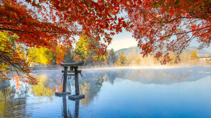 Canvas Print - Yufuin, Japan - Nov 27 2022: Tenso-jinja shrine at lake Kinrin, is one of the representative sightseeing spots in the Yufuin area at the foot of Mount Yufu.