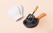 © 婷婷 季 - Cartoon kitchen pan and chef hat in the white background, 3d rendering.