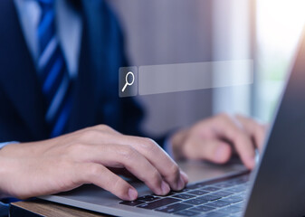 Wall Mural - businessman showing internet search in laptop