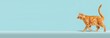 © id512 - banner ginger orange cat walking on a light blue background