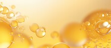 Abstract Background Banner With Various Yellow Bubbles Of Oil Or Serum, Providing Copy Space. Represents