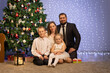 © Evgenia Tiplyashina - christmas family near christmas tree