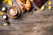 Autumn hygge concept with coffee and croissants