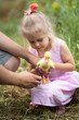 © Evgenia Tiplyashina - Little girl holding a duck