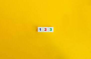 Wall Mural - 123 Concept. Letter Tiles on Yellow Background. Minimal Aesthetic.