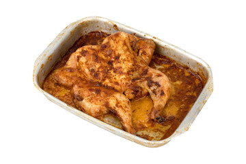 Wall Mural - Baked chicken on a baking sheet. Chicken baked in the oven on a baking sheet close-up isolated on a white background.