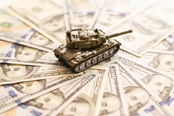 tank against the background of dollars. Concept of war.