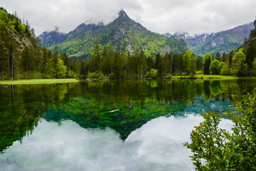  lake with wonderful reflections from the mountains and green hills