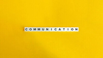 Wall Mural - communication word on block letter tiles on yellow background. minimal aesthetic.