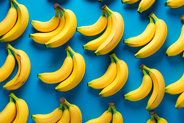 Poster - Fresh yellow bananas pattern on blue background. Top view