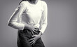 © Yevhen - Woman Hands Holding Her Crotch. Sick woman hands holding pressing her crotch lower abdomen. Black and white