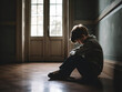 A depressed young boy suffering from depression sitting alone in the hall feeling loneliness. Upset bullied teen boy suffering sitting in corridor, Social problems, children's rights