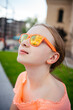 © Анна Молько - portrait of a girl in orange glasses. selective focus