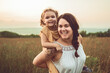 © Louis-Photo - Happy family mother with children daughter on nature sunset