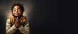 © JoelMasson - A young boy of African ethnicity praying. Christian religious prayer and devotion banner with copy space. Generative AI illustration