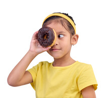 Donut, Eye And Cover Of Little Girl With Junk Food, Sugar And Looking Hungry Isolated On A Transparent PNG Background. Snack, Cake And Cute Face Of Young Child With Dessert For Eating Sweet Chocolate